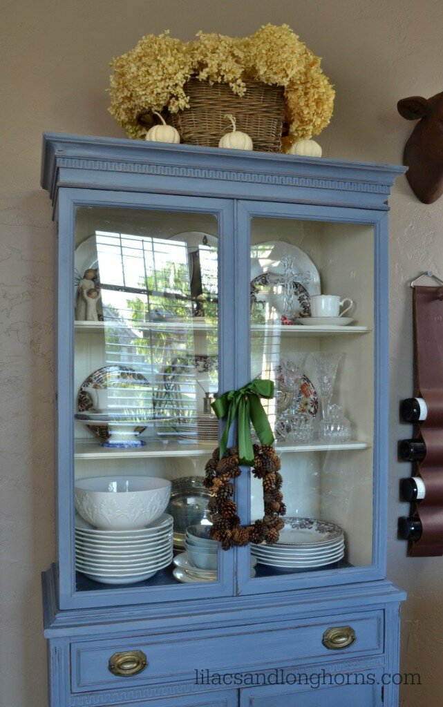 blue hutch with fall decor