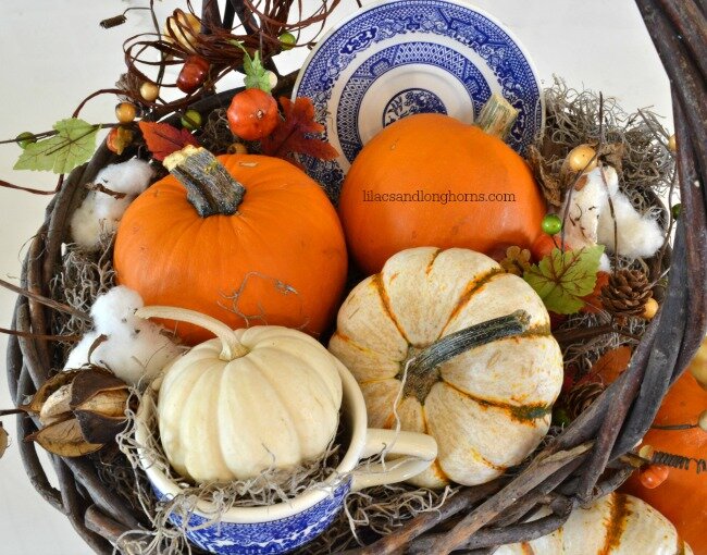 basket of pumpkins and plates